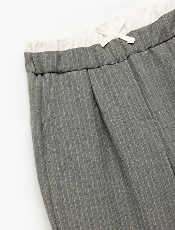 Beli Lastikli Fiyonklu Viskon Karışımlı Cep Detaylı Bol Kalıp Geniş Paça Pantolon