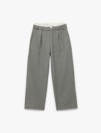 Beli Lastikli Fiyonklu Viskon Karışımlı Cep Detaylı Bol Kalıp Geniş Paça Pantolon