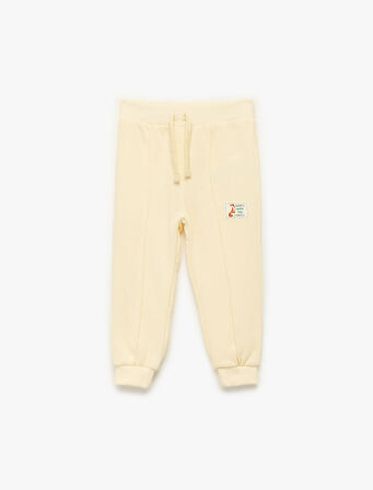 Pamuklu Beli Bağcıklı Nervürlü Şardonlu Etiket Baskılı Jogger Eşofman Altı