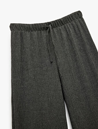 Bürümcük Kumaş Bağlama Detaylı Geniş Paça Pantolon