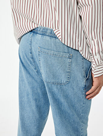 Pamuklu Cep Detaylı Beli Bağcıklı Bol Kalıp Jean Pantolon