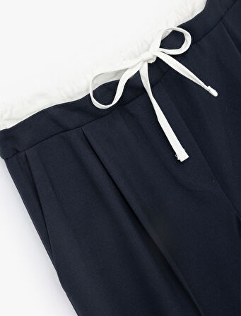 Ekstra Kumaş Detaylı Beli Bağlamalı Cepli Geniş Paça Baggy Pantolon