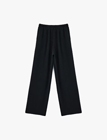 Rahat Kalıp Cep Detaylı Beli Bağcıklı Aerobin Kumaş Geniş Paça Pantolon