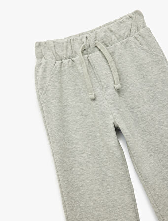 Ribanalı Kesik Paça Detaylı Beli Bağcıklı Eşofman Altı