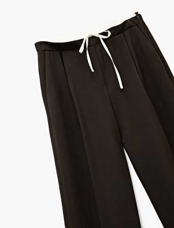 Cepli Pile Detaylı Beli Bağcıklı Geniş Paça Kumaş Pantolon