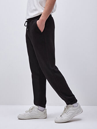 Beli Lastikli Dar Paça Siyah Eşofman