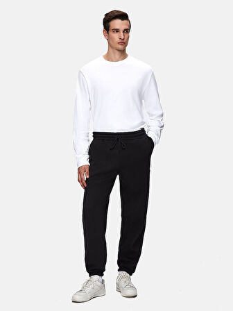 Beli Lastikli Dar Paça Siyah Eşofman