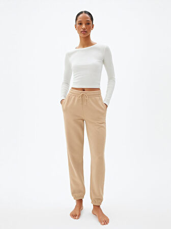 Beli Lastikli Dar Paça Krem Eşofman