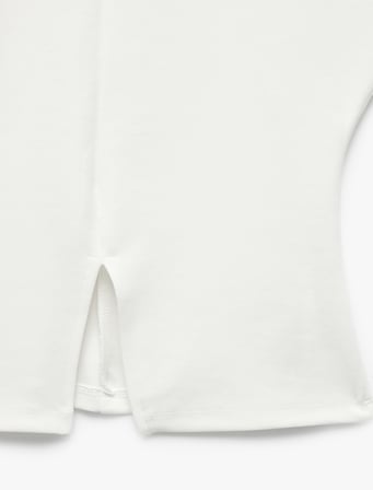 Pamuklu Slim Fit Hafif Peplum Kesim Kısa Kollu Bisiklet Yaka Yırtmaç Detaylı Tişört