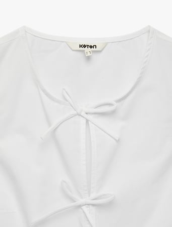 Pamuklu Kolsuz Yuvarlak Yaka Peplum Kesim Fiyonklu Poplin Bluz