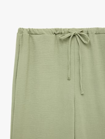Keten Görünümlü Beli Bağcıklı Cepli Düz Geniş Paça Pantolon
