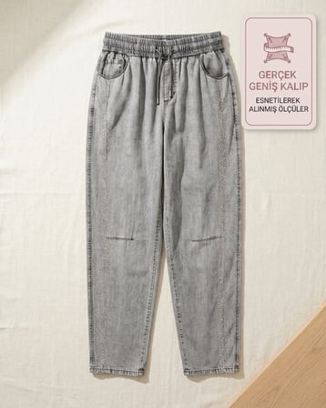 Büyük Beden Beli Lastikli Bağcıklı Yandan Taşlı Şerit Detaylı Dökümlü Tensel Kumaş Bol Paça Denim Kadın Pantolon