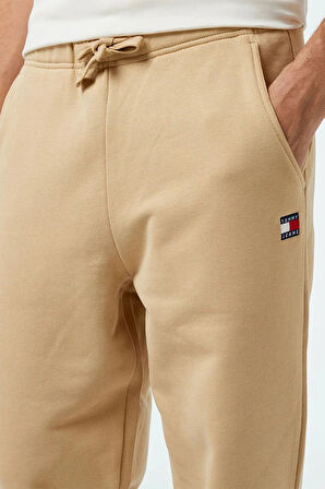 Tommy Jeans TJM REG BADGE JOGGER Erkek Bej Eşofman Altı DM0DM18355AB9