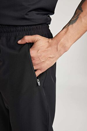 DeFactoFit Dokuma Esnek Multifonksiyonel Sporcu Jogger Eşofman Altı Slim Fit Dar Kesim Çift Cepli C1212AX24SPBK81