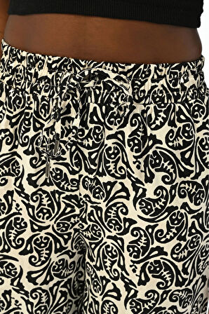 KADIN BELİ LASTİKLİ BOL PAÇA KARIŞIK SİYAH BEYAZ DESENLİ PANTOLON