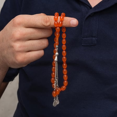 Metal Püsküllü Turuncu Arpa Kesim Sıkma Kehribar Tesbih