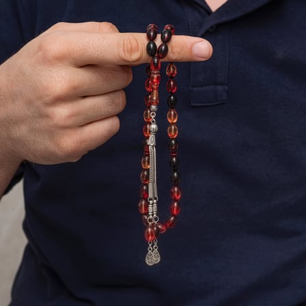 Metal Püsküllü Siyah ve Ateş Tonlu Sıkma Kehribar Tesbih