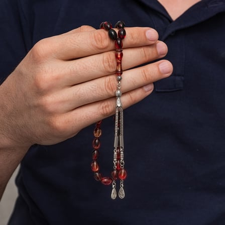 Metal Püsküllü Siyah ve Ateş Tonlu Sıkma Kehribar Tesbih