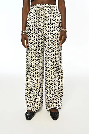 KADIN DESENLİ BELİ LASTİKLİ BOL PAÇA PANTOLON