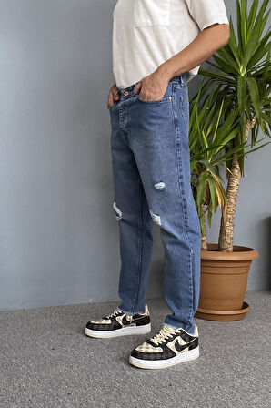 Paçaları Yırtık Detaylı Mavi Kot Pantolon