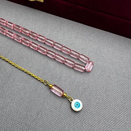 Nazar Boncuğu Detaylı Pirinç Püsküllü Bilek Boy Kapsül Kesim Pembe Uçak Camı Tespih