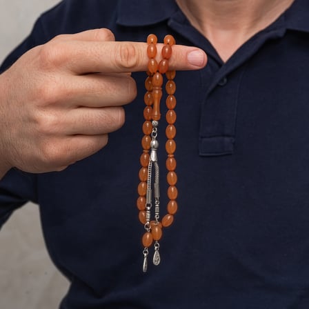 Metal Püsküllü 7x11 mm Turuncu Sıkma Kehribar Tesbih