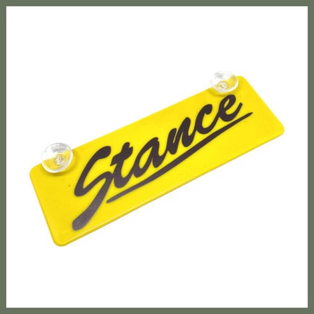 Bezos Stance Yazılı Sarı Dekor Plaka Vantuzlu Cam Süsü 22x7.5cm BEZOS1