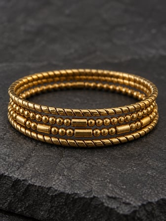 Dora’s Shine Altın Işıltısı 4’lü Paslanmaz Çelik Kadın Bileklik Seti – Gold Renk Burgu, Top Boncuk ve Silindir Detaylı - 63 numara - 19 - 21 cm