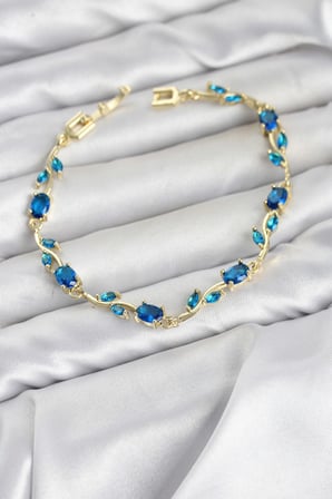 Pirinç Gold Renk Mavi Zirkon Taşlı Çiçek Model Kadın Bileklik