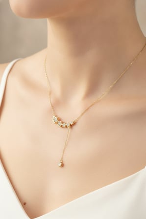 Pirinç Renk Minimal Sallantılı Yıldız Model Kadın Kolye