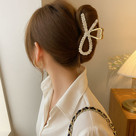 Taş Detaylı Gold Fiyonk Formlu 11 cm Saç Tokası – Zarif ve Işıltılı Tasarım