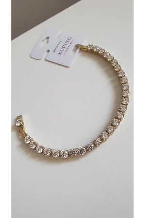 ÇELİK BİLEKLİK XUPİNG SU YOLU BAGET TAŞLI 14 AYAR GOLD RENGİNDE SAVOROSKİ TAŞLI 17+2 CM FMACCESORİES