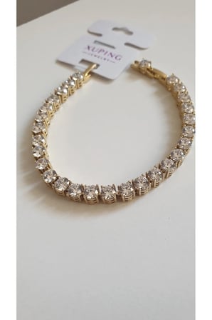 ÇELİK BİLEKLİK XUPİNG SU YOLU BAGET TAŞLI 14 AYAR GOLD RENGİNDE SAVOROSKİ TAŞLI 17+2 CM FMACCESORİES