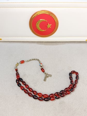 ATEŞ KEHRİBAR TESBİH KIRMIZI SİYAH HARELİ
