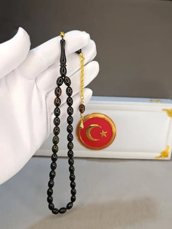 SİYAH SIKMA KEHRİBAR TESBİH AKICI ÇEKİMLİ