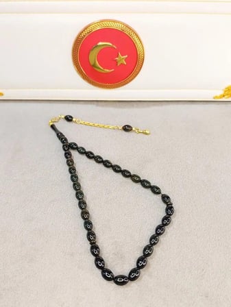 SİYAH SIKMA KEHRİBAR TESBİH AKICI ÇEKİMLİ