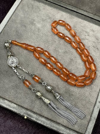 Alpaka Tuğralı Asansör Püsküllü Sedef Simli Ateş Kehribar Tesbih (7x11 mm)