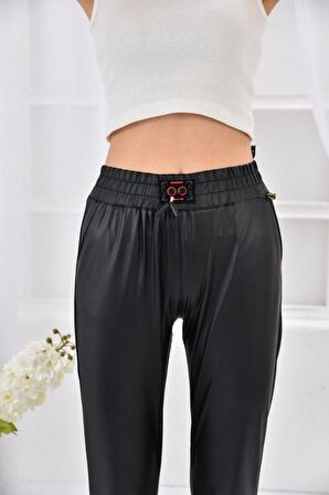 Modkofoni Bel ve Paça Lastikli Bağcık Detaylı Siyah Kadın Deri Pantolon