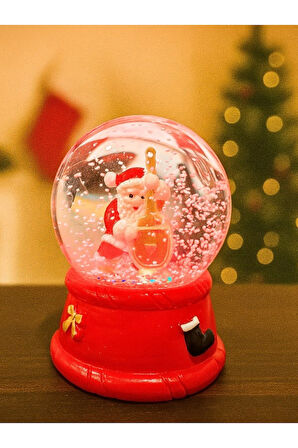 Yeni Yılın En Güzel Hediyesi 2026 Yılbaşı Çello Çalan Noel Baba Temalı Led Işıklı 9 cm Kar Küresi