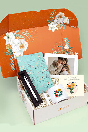 Turuncu Kutusunda Defter & Tükenmez Kalem & Beyaz Çerçeve &  T Kupa Hediye Seti