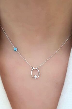 Nazar boncuklu ve zirkon taş detaylı gümüş ö harfi kolye