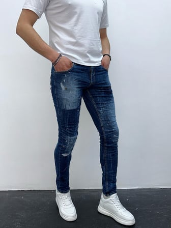 Erkek Mavi Slim Fit Yıpratılmış ve Boya Detaylı Denim Pantolon – Modern Sokak Stili, Rahat Kesim