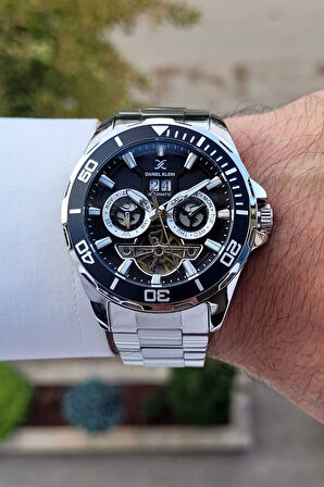 Daniel Klein DKISTE1261 Kadranı Siyah Kordonu Gümüş Renk Otomatik Takvimli Hediye Paketli Erkek Kol Saati