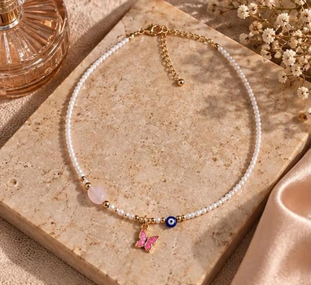  Pembe Kelebek Figürlü İnci Görünümlü Boncuk Kolye