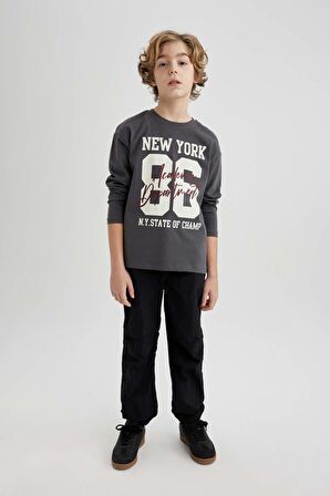 DeFacto Erkek Çocuk Beli ve Paçası Lastikli Cepli Siyah Jogger Paraşüt Basic Düz Pantolon B6602A824SMBK27