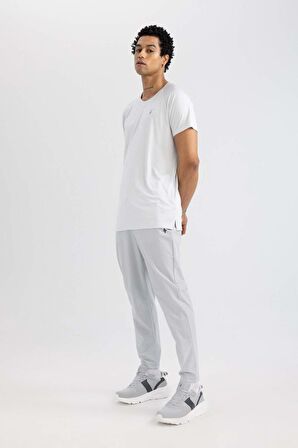 DeFactoFit Sporcu Jogger Eşofman Altı Slim Fit Dar Kesim Çift Cepli Standart Paça Dokuma B5157AX24SPGR91