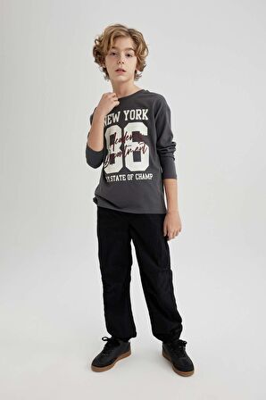 DeFacto Erkek Çocuk Beli ve Paçası Lastikli Cepli Siyah Jogger Paraşüt Basic Düz Pantolon B6602A824SMBK27