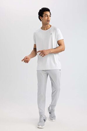 DeFactoFit Sporcu Jogger Eşofman Altı Slim Fit Dar Kesim Çift Cepli Standart Paça Dokuma B5157AX24SPGR91